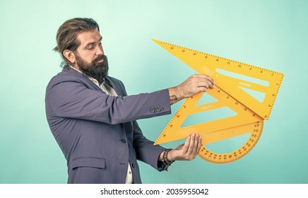 Pass The Exam. Learning The Subject. Back To School. Happy Teachers Day. Brutal Man With Beard Use Mathematics Tools. Informal Education. Male Student Sit In Classroom While Lesson