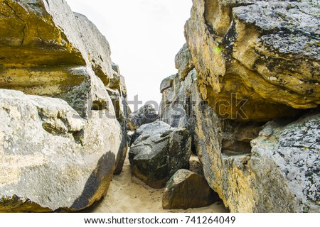 Passage between large stones.