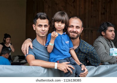 Passau, Germany - August 1st, 2015: Syrian refugee family at a camp in Passau, Germany .They are seeking asylum in Europe