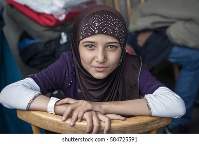 Passau, Germany - August 1st, 2015: Syrian refugee girl at a camp in Passau, Germany. The several organisations try to push them through registration fast in order to manage the critical situation