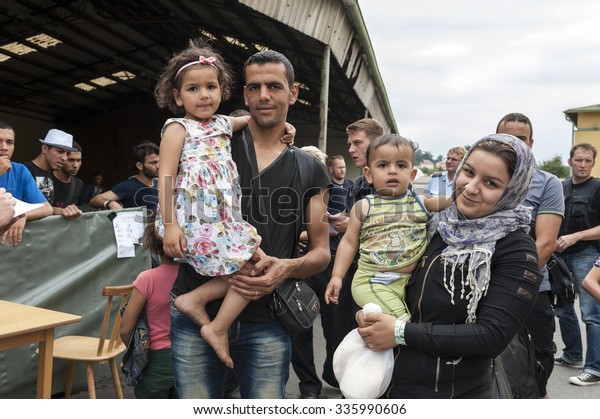 Passau, Germany - August 1st, 2015:\
Syrian refugee family at a camp in Passau,\
Germany