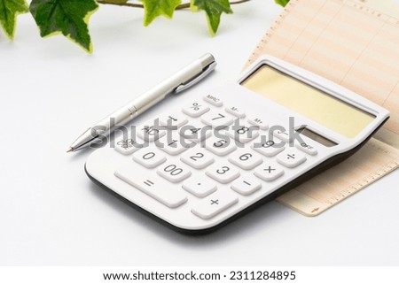 Passbook, calculator and ballpoint pen. In the passbook, 