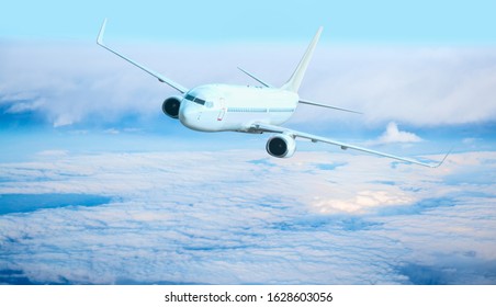 Passenger airplane in the clouds. travel by air transport