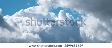 Passenger Airplane Flying Through Dramatic Cloudy Sky