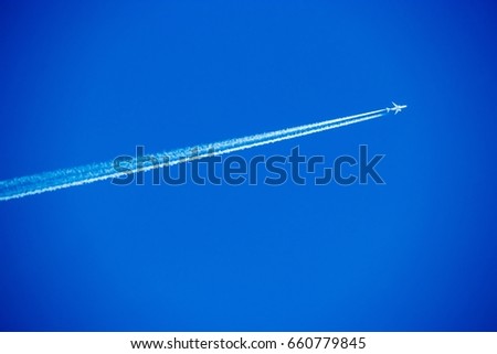 Passenger airplane in the sky on sunny cloudless day