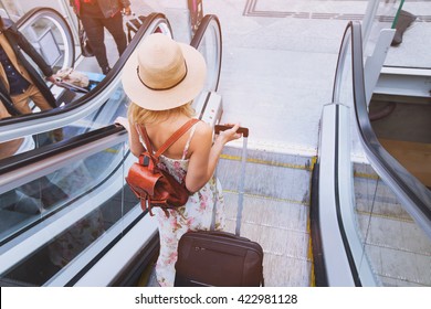 Passenger In Airport Or Modern Train Station, Woman Commuter Travels With Luggage