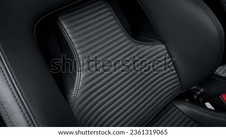 Passenger car seat in black showing the seat back