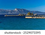 Passenger and cargo port in Trpancia on the Peljesac Peninsula, tourist attraction, place where ships dock, statue of Our Lady of the Whistle of the Sea



