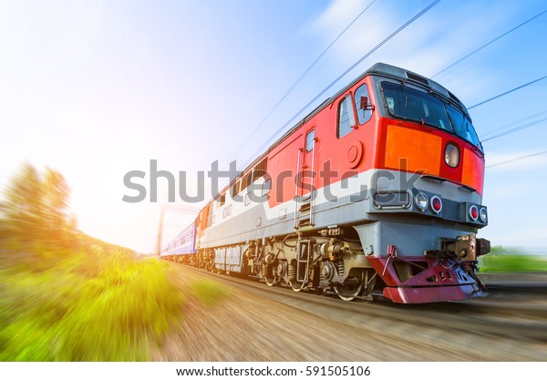 Passenger diesel train traveling speed railway\
wagons journey light