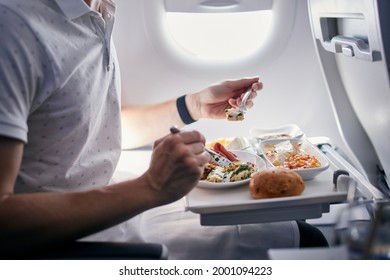 Passenger eating airline meal. Menu in business class on medium haul flight. - Powered by Shutterstock