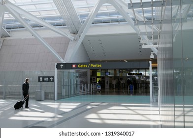 Passenger entering departure gates to domestic flights at Pearson International Airport Terminal 1 Toronto, Ontario, Canada - October 25, 2008
