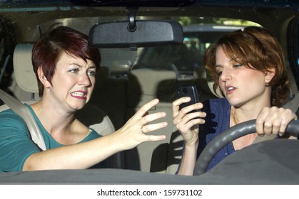 passenger frightened by reckless driver holding a cell phone