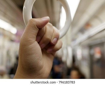 Passenger Hand Hold Strap While Standing In Subway Or Sky Train.