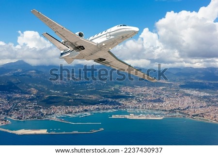 passenger jet flying over Palma de Mallorca, Spain, for aircraft transportation and travel business background