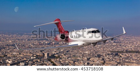 Passenger jet flying over Paris, France