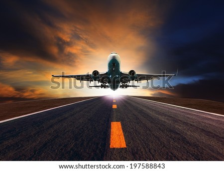 passenger jet plane flying over airport runway against beautiful dusky sky use for aircraft transport and cargo logistic and traveling business industry