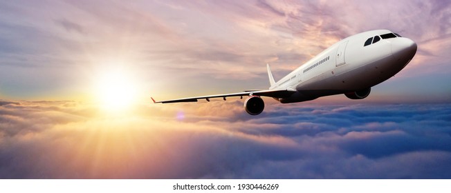 Passenger jetplane flying above clouds in sunset. Beautiful sunset scenery, transportation and fast travel concept. - Shutterstock ID 1930446269
