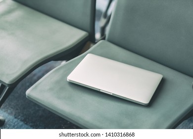 Passenger Lost Laptop Computer On The Airport Chair 