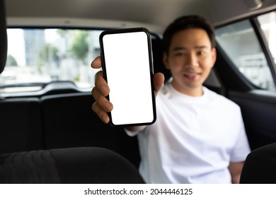 Passenger Man Showing Empty Application On Mobile Phone While Sitting On Back Seat In Car