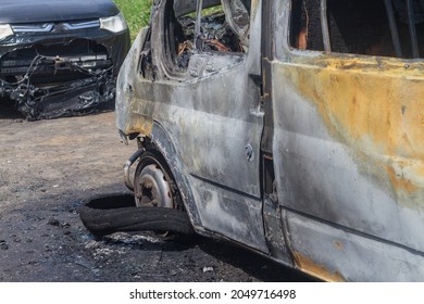 Passenger Minibus After A Fire, Burnt Body And Interior Of The Car.