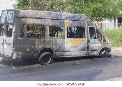Passenger Minibus After A Fire, Burnt Body And Interior Of The Car.