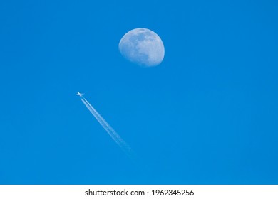 Passenger Plane - Airliner Passes Near The Moon. Explore New Frontier. Space Traveler Concept