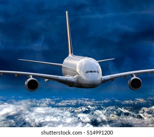 Passenger plane close-up. The wide-body aircraft in flight. Airplane flying high above the clouds and mountain landscape.