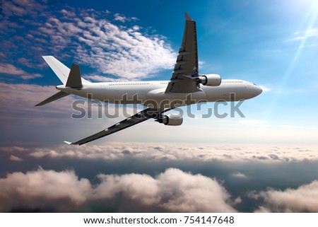 Passenger plane flies over the clouds