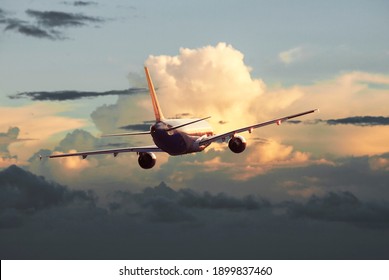 Passenger Plane Flying In The Clouds, Air Travel Concept