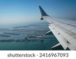 Passenger plane flying over Miami descends for landing at Miami International Airport