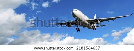 Passenger plane. Landscape with big white airplane and flying over the sea. Passenger plane lands at dusk. Business trip. commercial aircraft. Trip