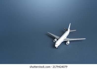 Passenger Plane On A Blue Gray Background. Passenger Transportation. Business And Tourism. Airline Operators, Air Carriers. World Communication And Commercial Flights. Travel.