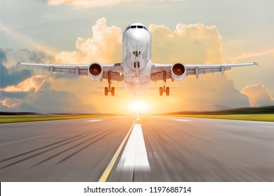 Passenger Plane Take Off From The Runway Before The Light From The Sunshine