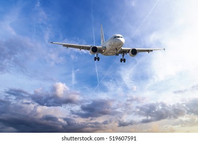 Passenger Plane Take Off From Runways Against Beautiful Cloudy Sky.