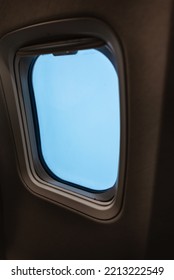 Passenger Plane Window Without People With Blue Sky Close Up