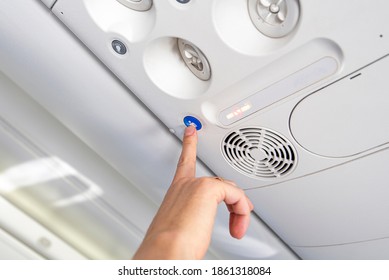 Passenger Pressing The Button To Call Cabin Crew, Stewardess For A Service