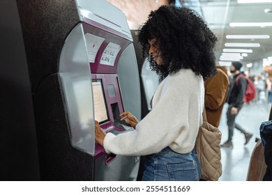 Passenger purchasing ticket using electronic terminal in metro station, modern urban transportation - Powered by Shutterstock - Get 15% off with code: PIKWIZARD15
