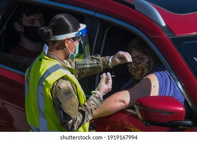 A Passenger Receives A COVID-19 Vaccine From A National Guard At A Joint State And Federal COVID-19 Vaccination Site On California State University Of Los Angeles In Los Angeles, Feb. 17, 2021.