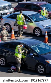 A Passenger Receives A COVID-19 Vaccine From A National Guard At A Joint State And Federal COVID-19 Vaccination Site On California State University Of Los Angeles In Los Angeles, Feb. 17, 2021.