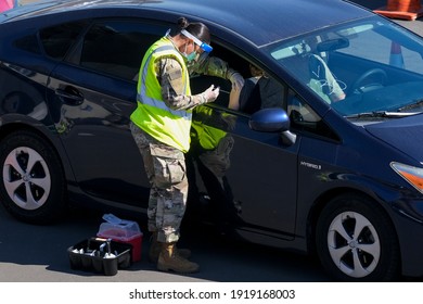 A Passenger Receives A COVID-19 Vaccine From A National Guard At A Joint State And Federal COVID-19 Vaccination Site On California State University Of Los Angeles In Los Angeles, Feb. 17, 2021.