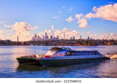 Passenger Rivercat Ferry On Parramatta River In View Of Sydney City CBD Landmarks Cityscape - Public Transport On Waterway.
