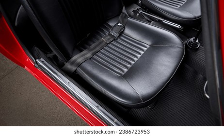 Passenger seat of a car showing the lap belt - Powered by Shutterstock