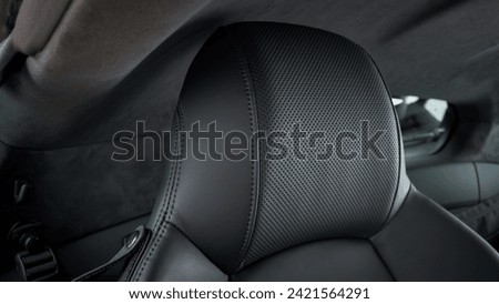 Passenger seat headrest inside of a car
