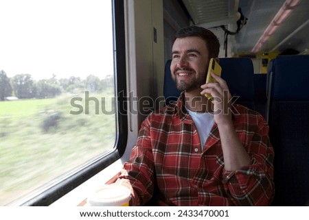 Passenger talking on the phone during train trip 