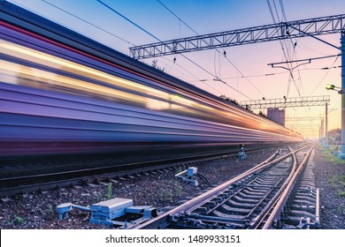 Passenger train moves fast at sunset time. - Shutterstock ID 1489933151