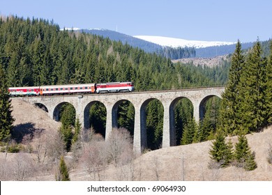 Passenger Train On Railway Viaduct Near Telgart, Slovakia