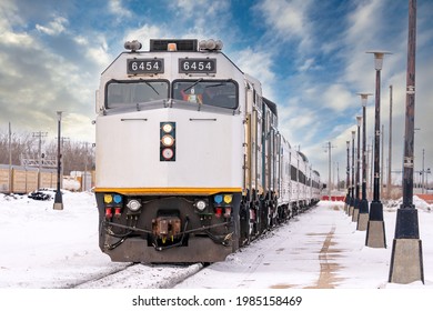 A Passenger Train Pulls Into The Station On A Cold Winter Morning In Canada