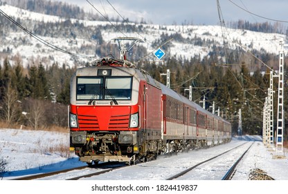 Passenger Train Siemens Taurus From Kosice To Bratislava Arrives At The Transit Railway Station Strba. Winter Weather. Slovak Railways.