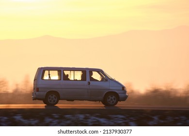 Passenger Van Driving Fast On Intercity Road At Sunset. Highway Traffic In Evening. Kyiv, Ukraine - October 12, 2021.