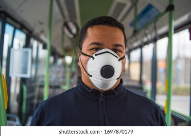 passenger wears mask in bus to protect himself from the coronavirus epidemic is alone in bus. Pandemic coronavirus 2020. Quarantine.Virus concept. Epidemic infection.